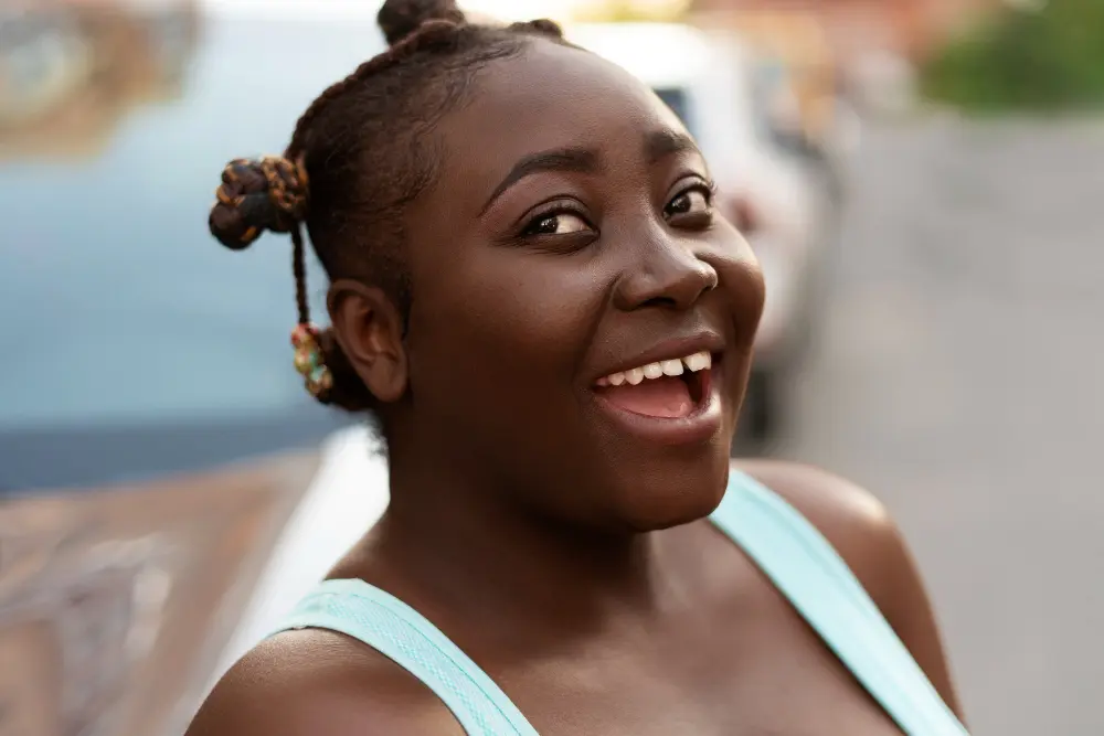 Black woman speaking with a Black female health professional